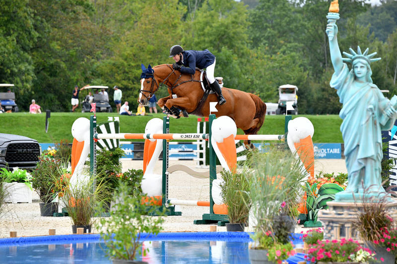 Jumper rider jumping a fence